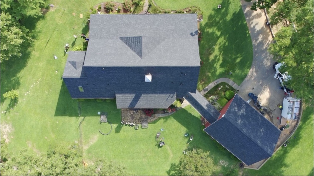 Completed roofs on a home and detached structure